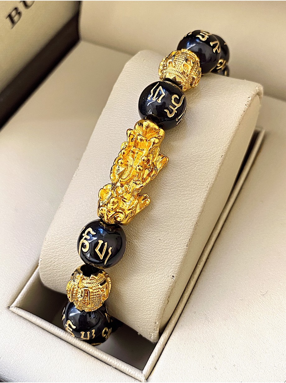 Bratara dama model deosebit cu margele negre si detalii aurii