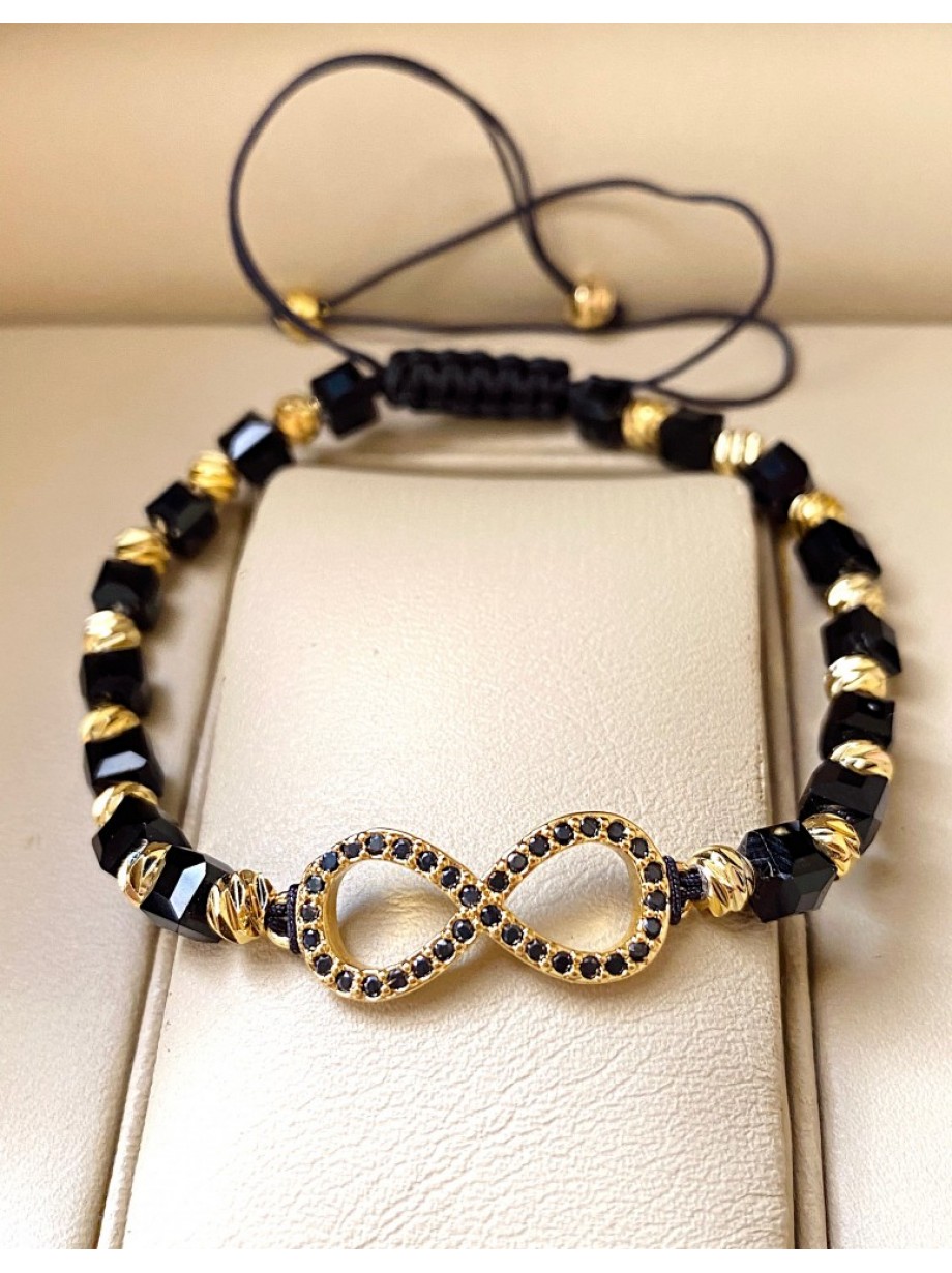 Bratara dama model deosebit cu margele negre cu auriu si infinit cu pietricele stralucitoare
