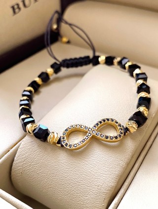 Bratara dama model deosebit cu margele negre cu auriu si infinit cu pietricele stralucitoare
