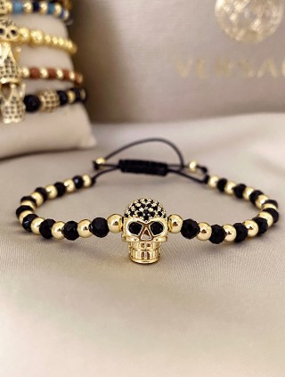Bratara dama model deosebit cu margele negre si aurii si craniu