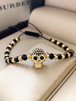 Bratara dama model deosebit cu margele negre si aurii si craniu