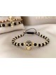 Bratara dama model deosebit cu margele negre si aurii si craniu