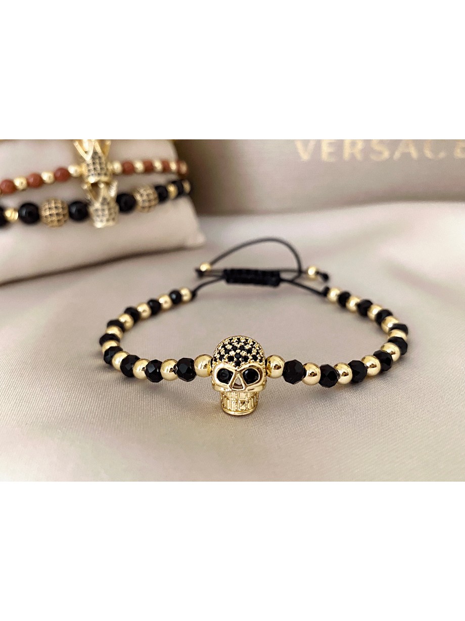 Bratara dama model deosebit cu margele negre si aurii si craniu