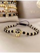 Bratara dama model deosebit cu margele negre si aurii si craniu