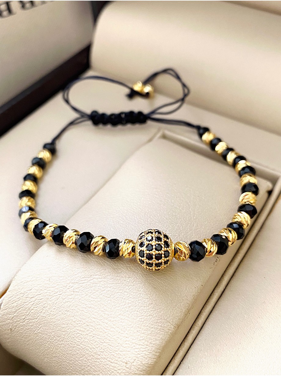Bratara dama model deosebit cu margele negre si aurii si biluta