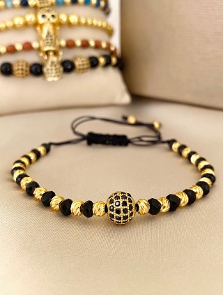 Bratara dama model deosebit cu margele negre si aurii si biluta