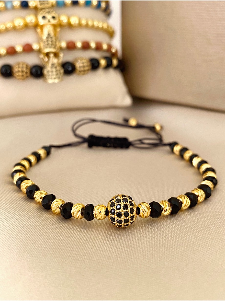Bratara dama model deosebit cu margele negre si aurii si biluta