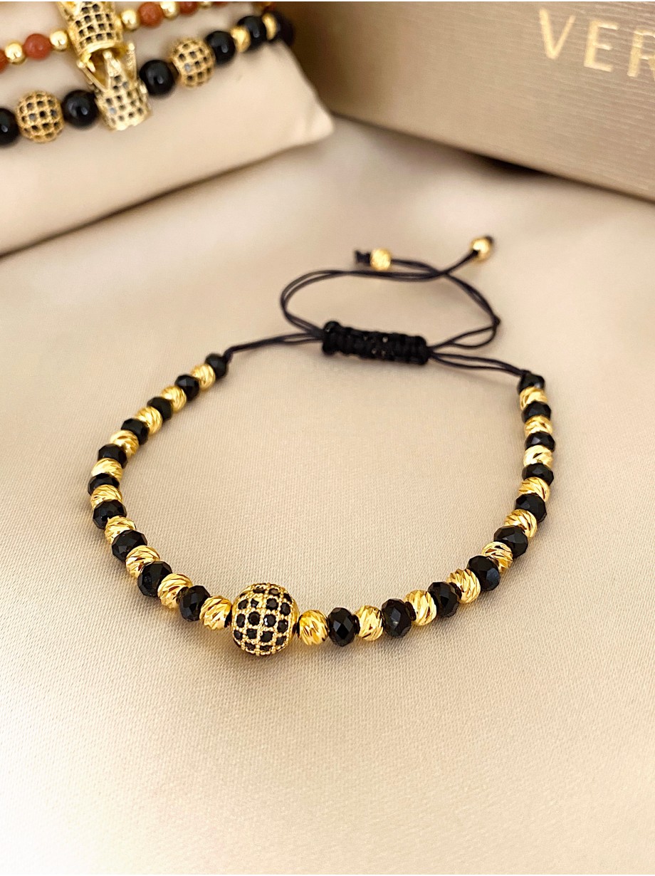 Bratara dama model deosebit cu margele negre si aurii si biluta