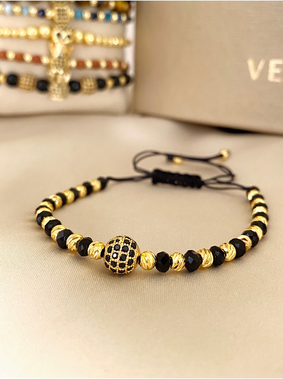 Bratara dama model deosebit cu margele negre si aurii si biluta