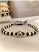 Bratara dama model deosebit cu margele negre si aurii si hexagon