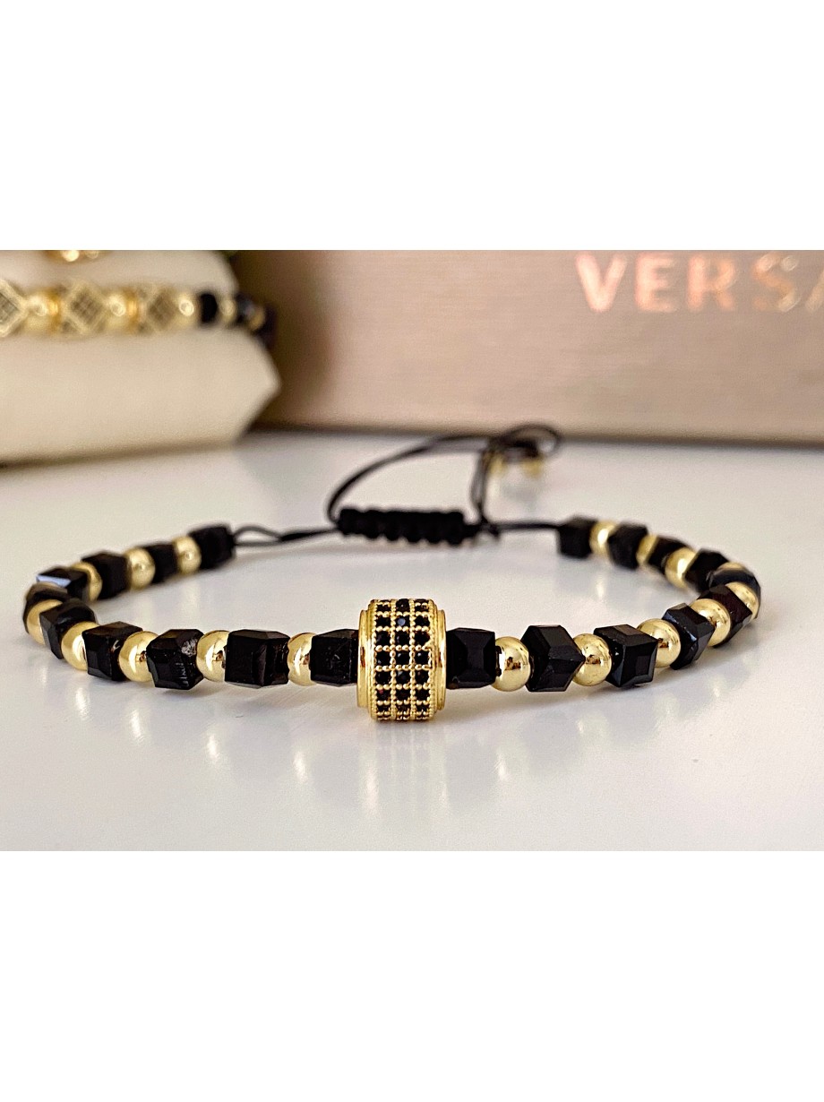 Bratara dama model deosebit cu margele aurii si negre si design cerc