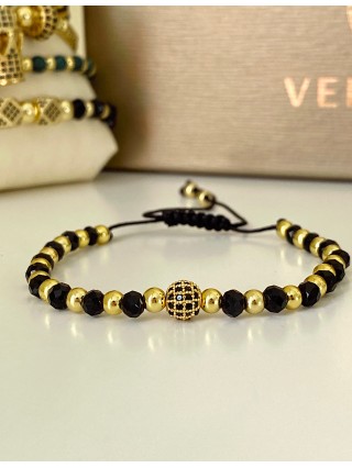 Bratara dama model deosebit cu margele aurii si negre si design biluta