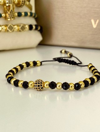 Bratara dama model deosebit cu margele aurii si negre si design biluta