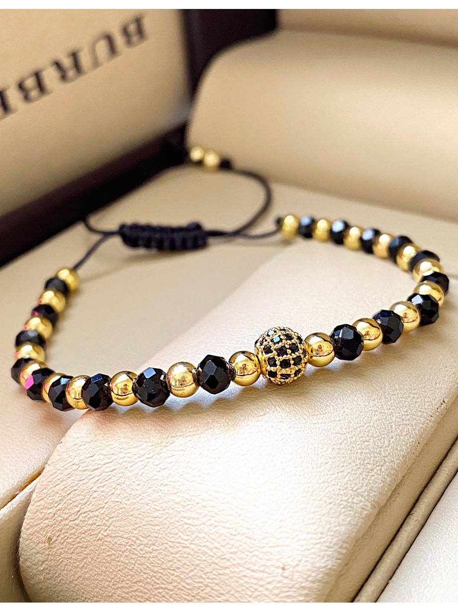 Bratara dama model deosebit cu margele aurii si negre si design biluta