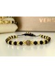 Bratara dama model deosebit cu margele aurii si negre si design biluta