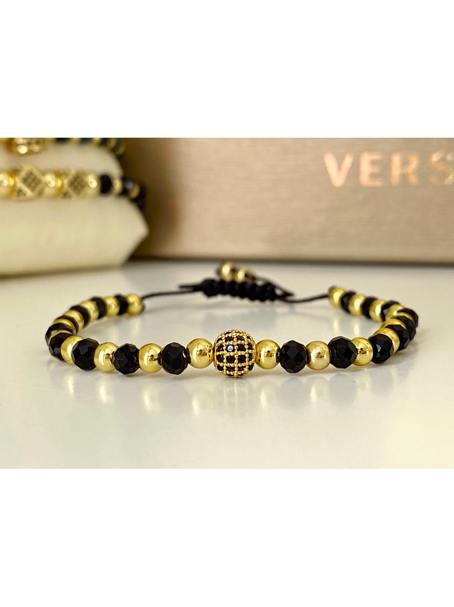 Bratara dama model deosebit cu margele aurii si negre si design biluta