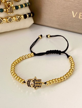 Bratara dama model deosebit cu margele aurii si palma cu pietricele negre