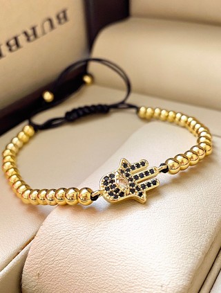 Bratara dama model deosebit cu margele aurii si palma cu pietricele negre