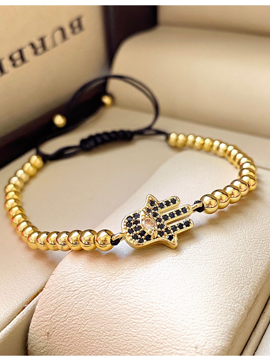 Bratara dama model deosebit cu margele aurii si palma cu pietricele negre