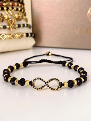 Bratara dama model deosebit cu margele negre cu auriu si infinit cu pietricele stralucitoare