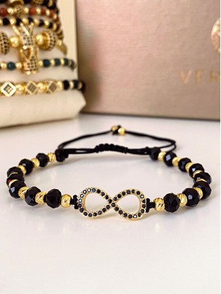 Bratara dama model deosebit cu margele negre cu auriu si infinit cu pietricele stralucitoare
