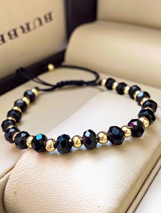 Bratara dama model deosebit cu margele negre cu auriu si design simplu