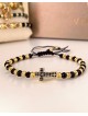 Bratara dama model deosebit cu margele negre cu auriu si design cruciulita