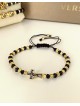 Bratara dama model deosebit cu margele negre cu auriu si design cruciulita