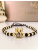 Bratara dama model deosebit cu margele aurii si negre si coroana cu pietricele negre