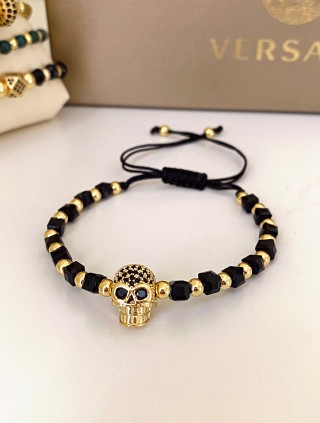 Bratara dama model deosebit cu margele negre si aurii si craniu