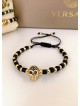 Bratara dama model deosebit cu margele negre si aurii si craniu