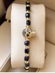 Bratara dama model deosebit cu margele negre si aurii si craniu