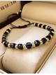 Bratara dama model deosebit cu margele aurii si negre simpla