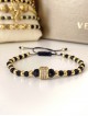 Bratara dama model deosebit cu margele negre si aurii si biluta