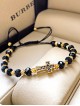 Bratara dama model deosebit cu margele negre si cruce cu pietricele negre