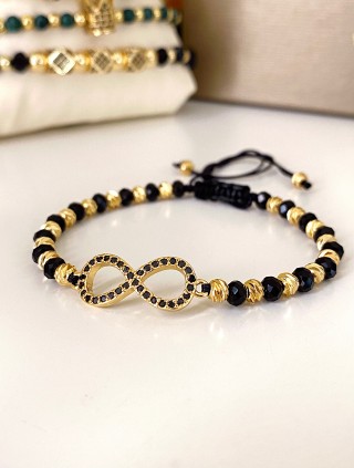 Bratara dama model deosebit cu margele negre cu auriu si infinit cu pietricele stralucitoare