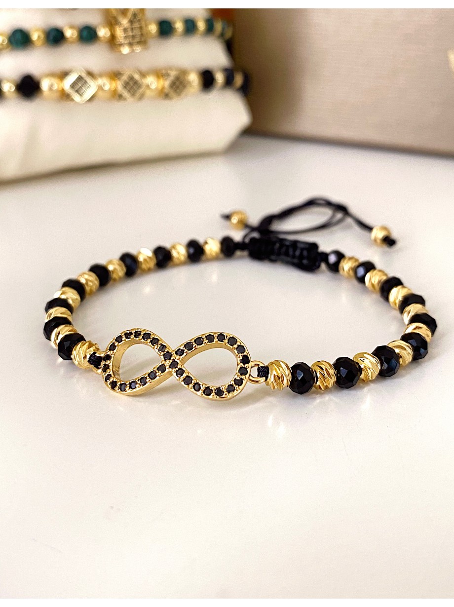 Bratara dama model deosebit cu margele negre cu auriu si infinit cu pietricele stralucitoare