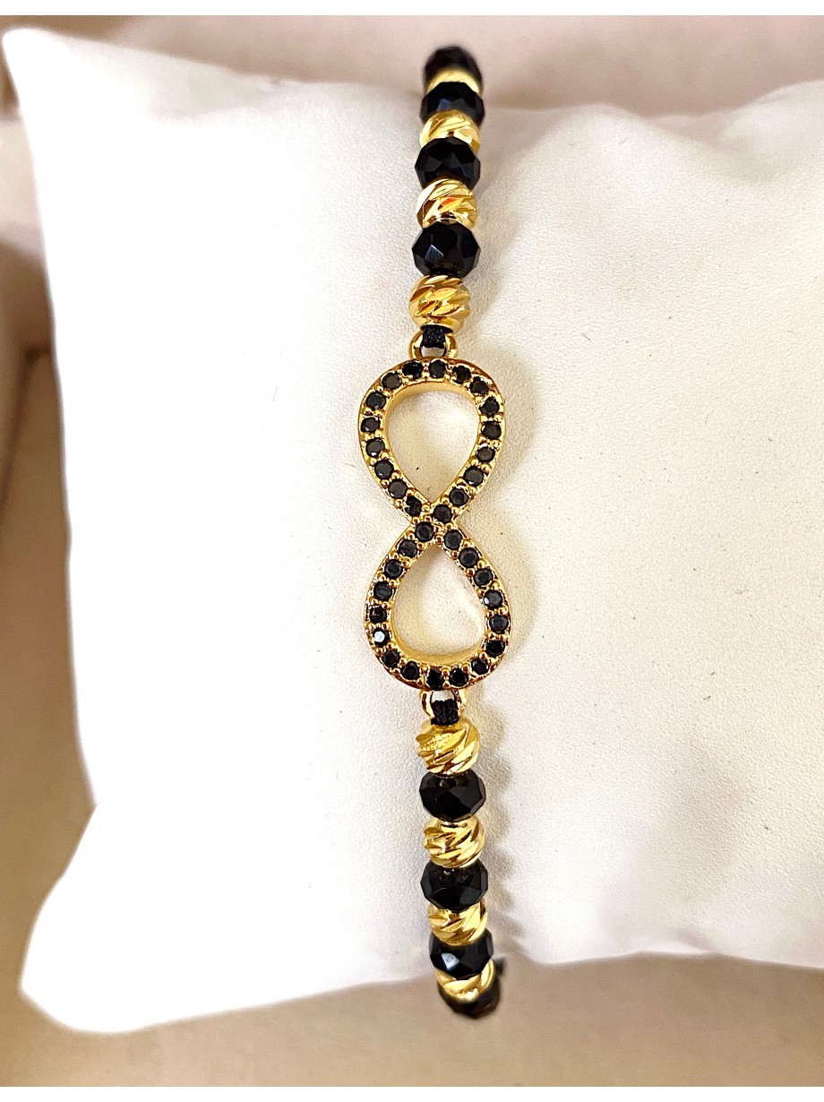 Bratara dama model deosebit cu margele negre cu auriu si infinit cu pietricele stralucitoare