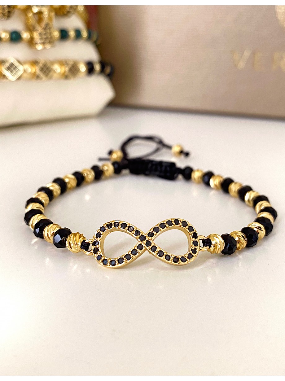 Bratara dama model deosebit cu margele negre cu auriu si infinit cu pietricele stralucitoare