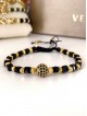 Bratara dama model deosebit cu margele aurii si negre si biluta cu pietricele negre