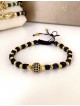 Bratara dama model deosebit cu margele aurii si negre si biluta cu pietricele negre