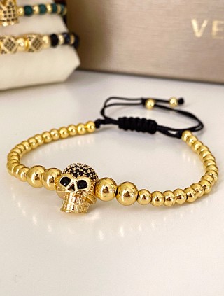 Bratara dama model deosebit cu margele aurii si craniu auriu