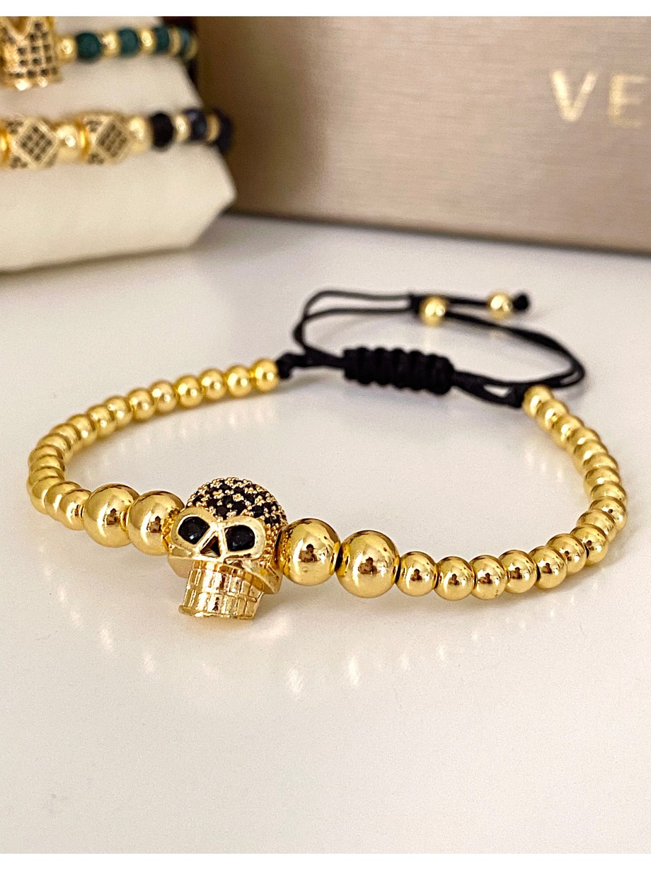 Bratara dama model deosebit cu margele aurii si craniu auriu