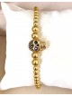 Bratara dama model deosebit cu margele aurii si craniu auriu