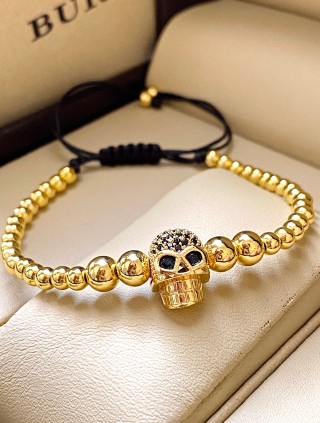 Bratara dama model deosebit cu margele aurii si craniu auriu