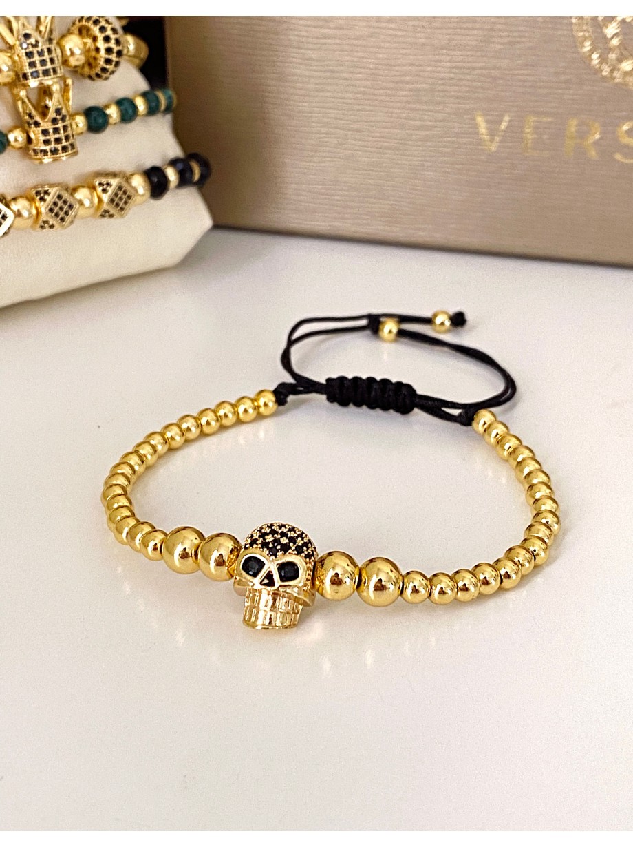 Bratara dama model deosebit cu margele aurii si craniu auriu