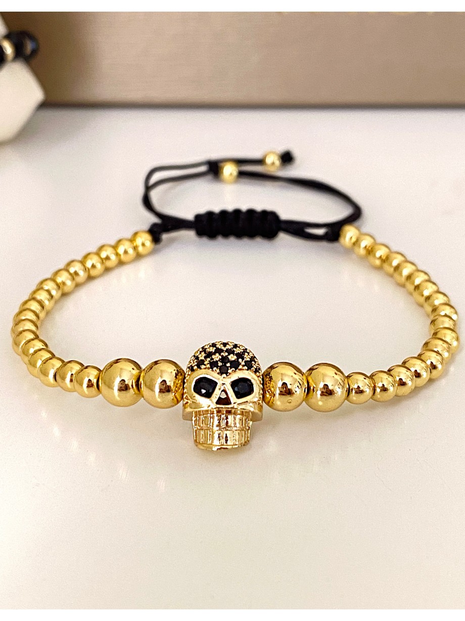 Bratara dama model deosebit cu margele aurii si craniu auriu