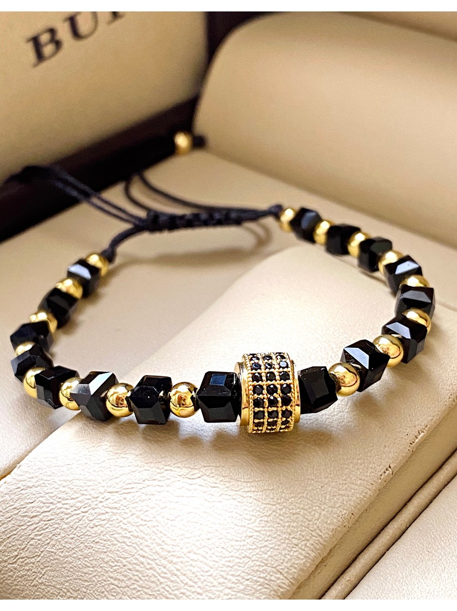 Bratara dama model deosebit cu margele aurii si negre si design cerc