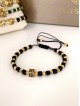 Bratara dama model deosebit cu margele negre si patrat cu pietricele negre