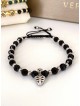 Bratara dama model deosebit cu margele negre si sageata cu pietricele negre